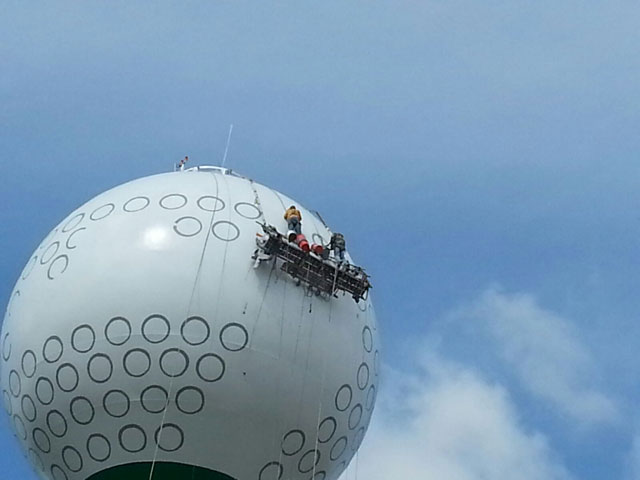 painting golf ball water tower
